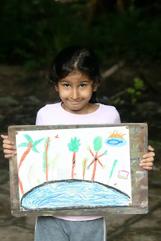 Girl rider showing her completed painting at Pune university campus
