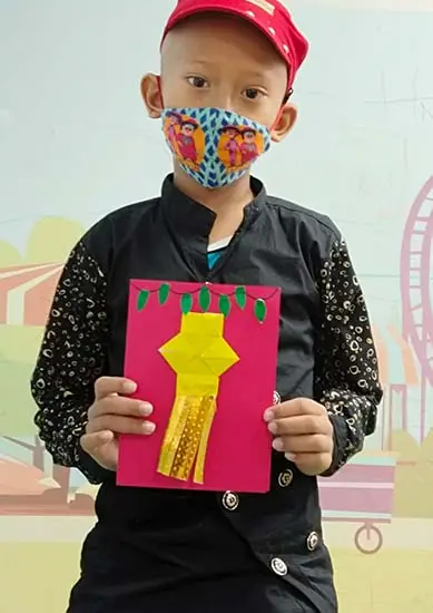 Kid showing greeting card