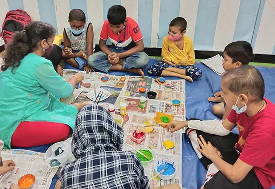 Painting of earthen lamps and greeting cards for Diwali at TMC, Mumbai