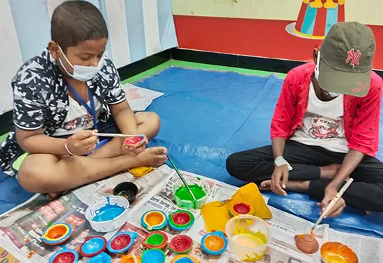 Kids  at painting workshop of earthen lamps and greeting cards at TMC, Mumbai