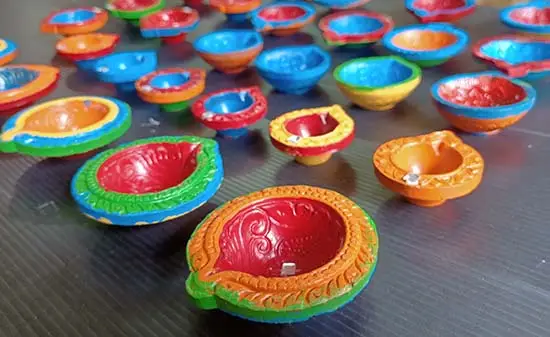 Diyas painted by chidren at workshop at TMC, Mumbai