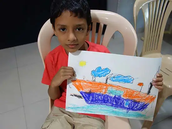 Chidren showing paiting at art workshop