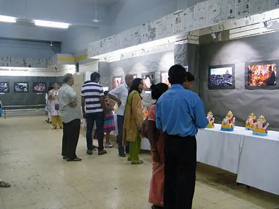 people visiting Balgandharav Kaladalan and viewing Eco-friendly ganesh idols exhibition