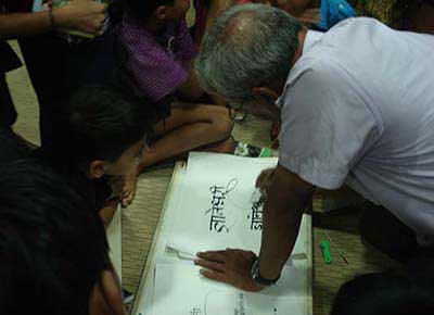 Calligraphy demonstration by Babu Udipi at Jnana Prabodhini Prashala