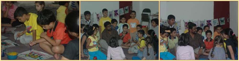 children in the art workshop with artist Kingsley Guntillake from Sri Lanka
