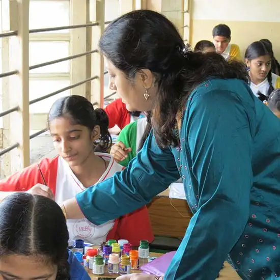 Artist Chitra Vaidya looking at kite