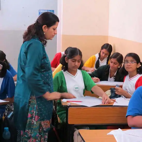 Chitra Vaidya explaining with girl