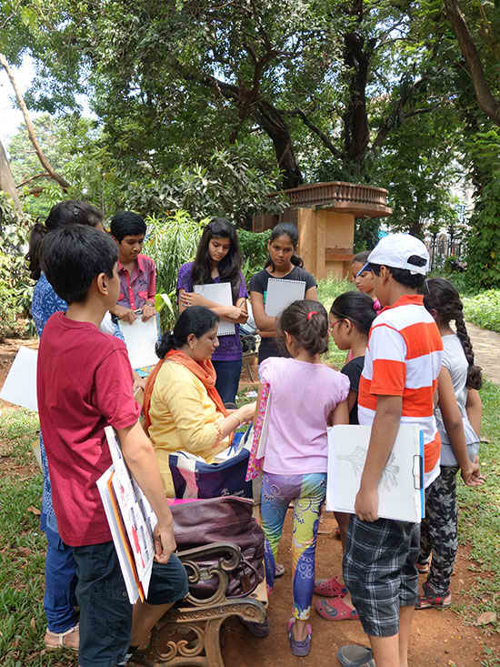 Chitra Vaidya with children in Outdoor painting workshop