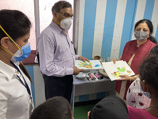 Dr. Banavali with Chitra Vaidya looking paintings at Tata Memorial Centre, Mumbai