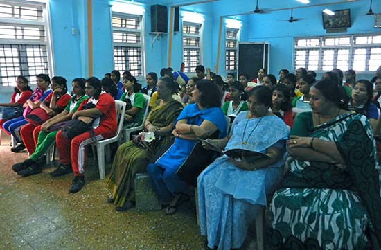 Teachers & Girls from Madhavrao Bhagwat High School looking at demonstration